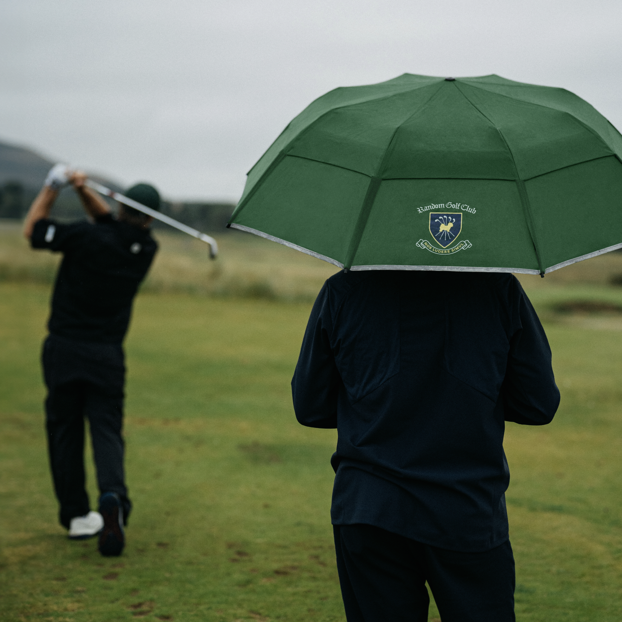 Men golfing with Weatherman Collapsible Umbrella in green Random Golf Club design.