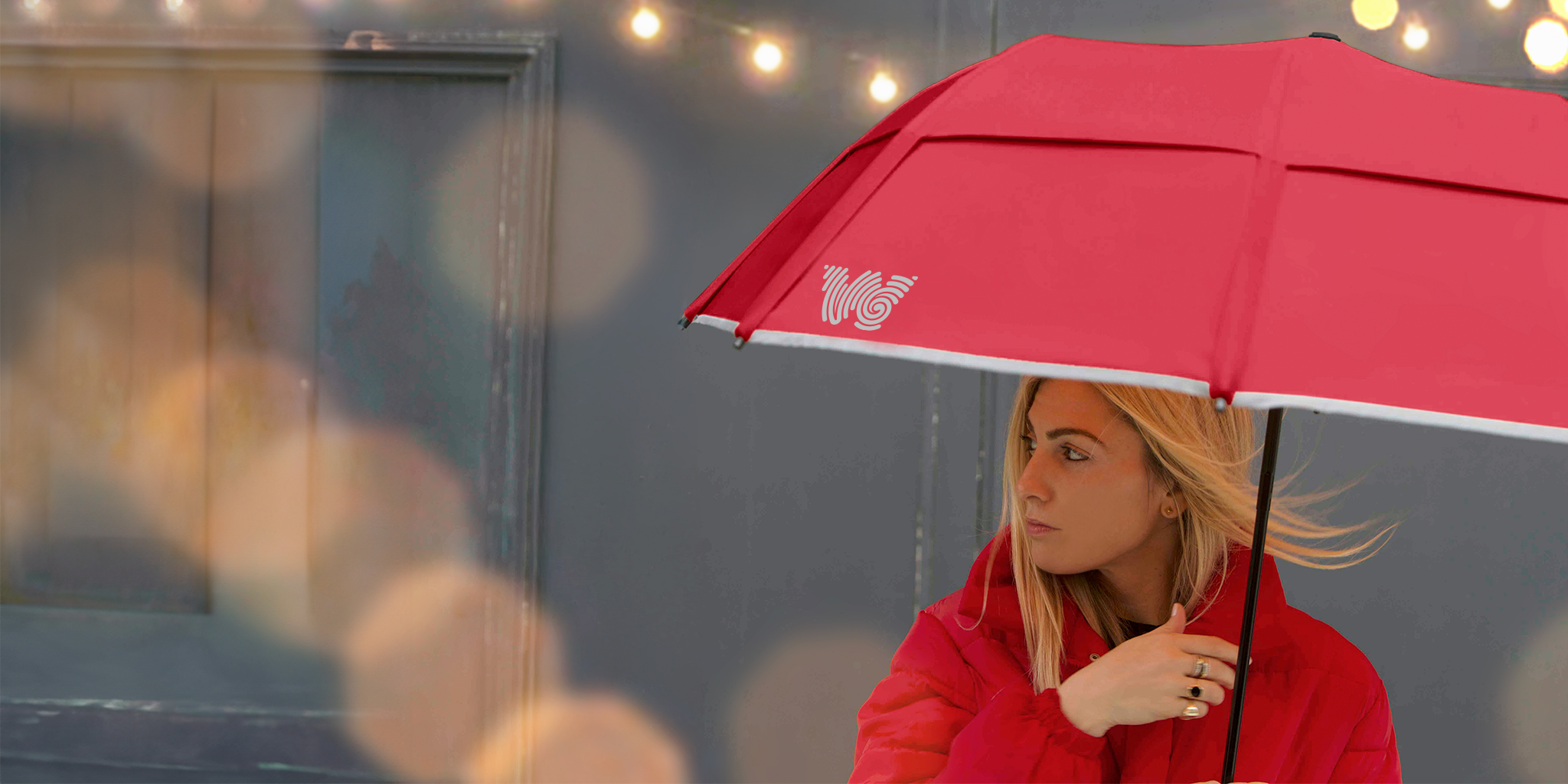 Woman holding Red Weatherman Collapsible Umbrella.